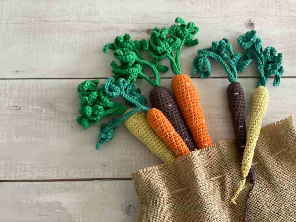 Crochet Rainbow Carrot Main Image in Burlap Sack