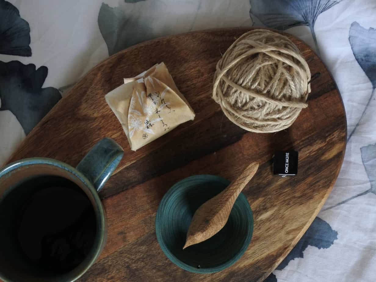 Top 5 Crochet Health Benefits Coffee Mug and Ball of Jute Yarn