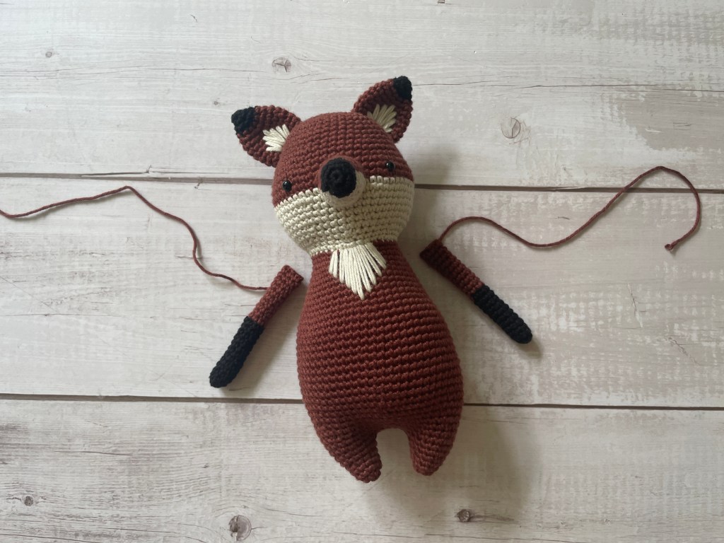 Fox crochet pattern in the making - putting on arms